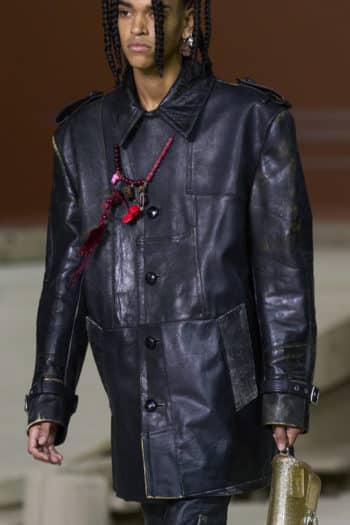 Oversized men's black leather jacket at Coach fashion show