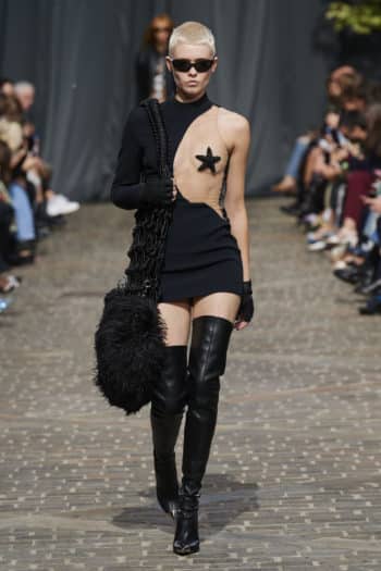 Black cut out dress with starfish high high electric blue boots at David Koma fashion Week SS23